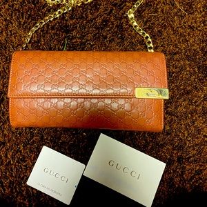 Gucci Orange Embossed Leather Clutch with Gold Chain